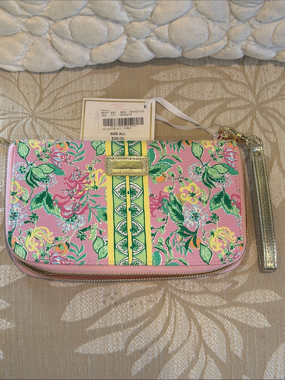 Lilly Pulitzer travel wallet.